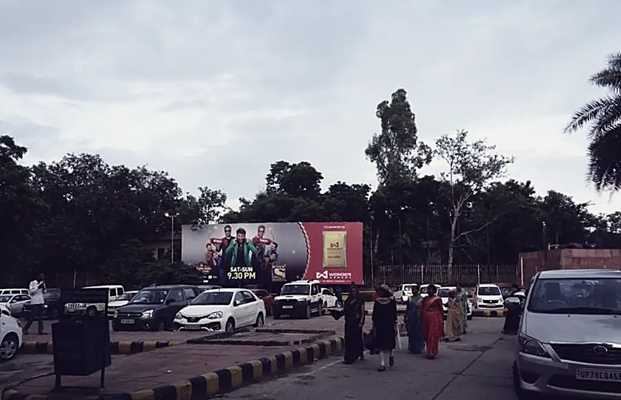 An Agra approach road with hoardings on both sides