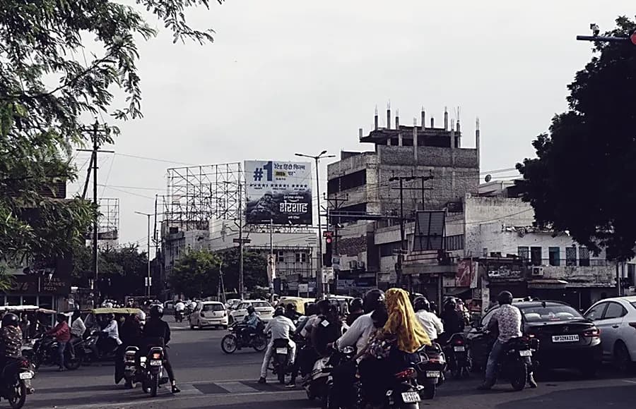 A junction in Agra with a gantry across the carriageway