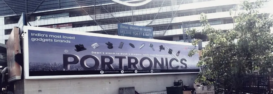 A long hoarding above a commercial frontage in Delhi